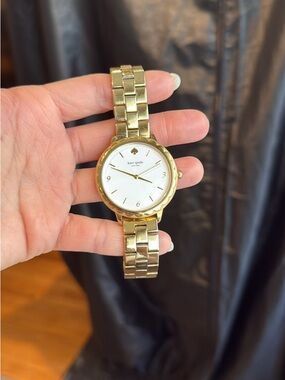 Women’s gold Kate spade scalloped watch